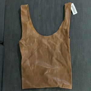 softest natural milled leather. Mid-sized for hand carrying.
